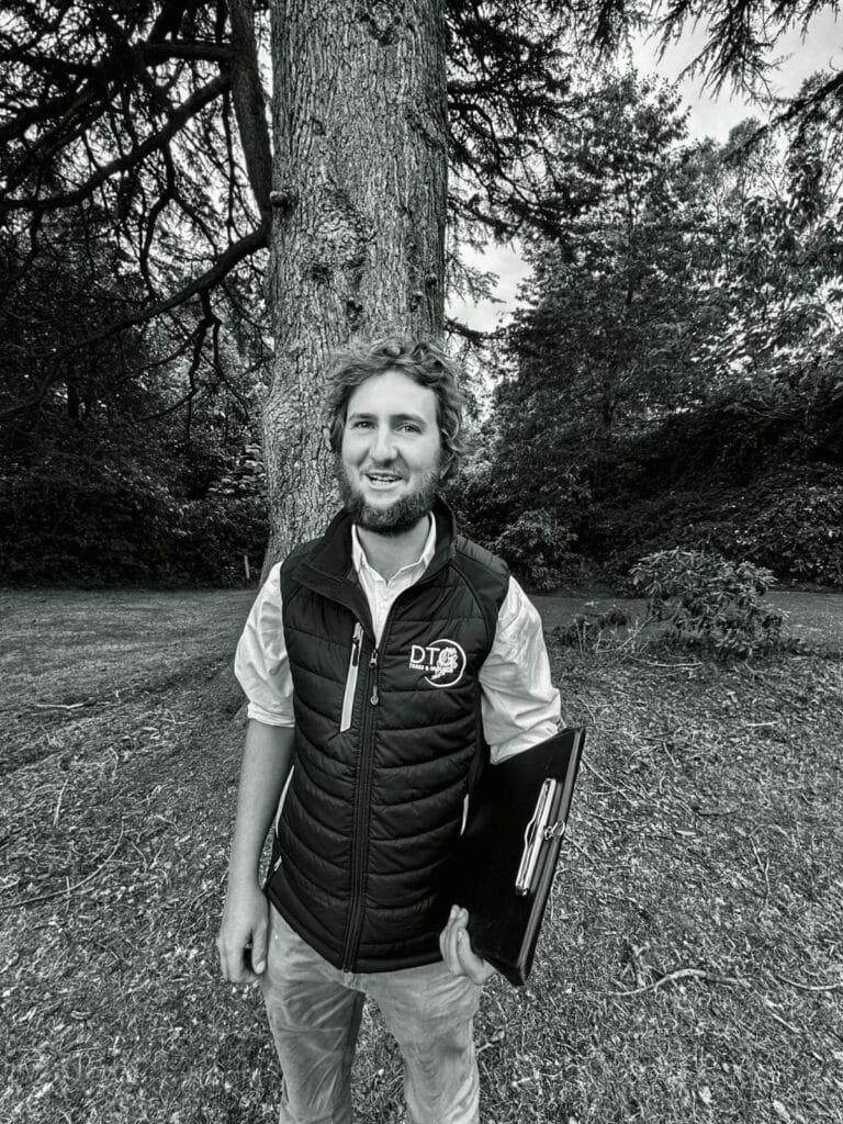 Devon Trees & Grounds Ltd professional arborist in outdoor setting.