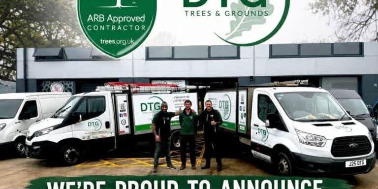 Devon Trees & Grounds Ltd team with ARB Approved Contractor vehicles outside office.